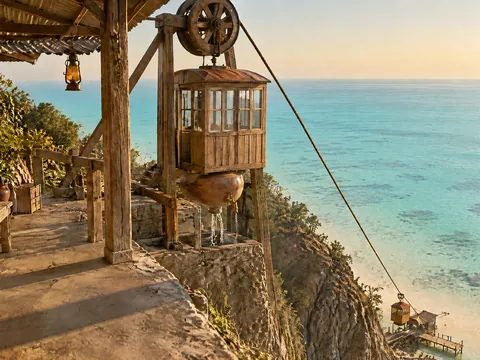Clifftop Station of the Water-Weight Cable Car, where a car with copper water jars hanging beneath it waits at the top of the cliff